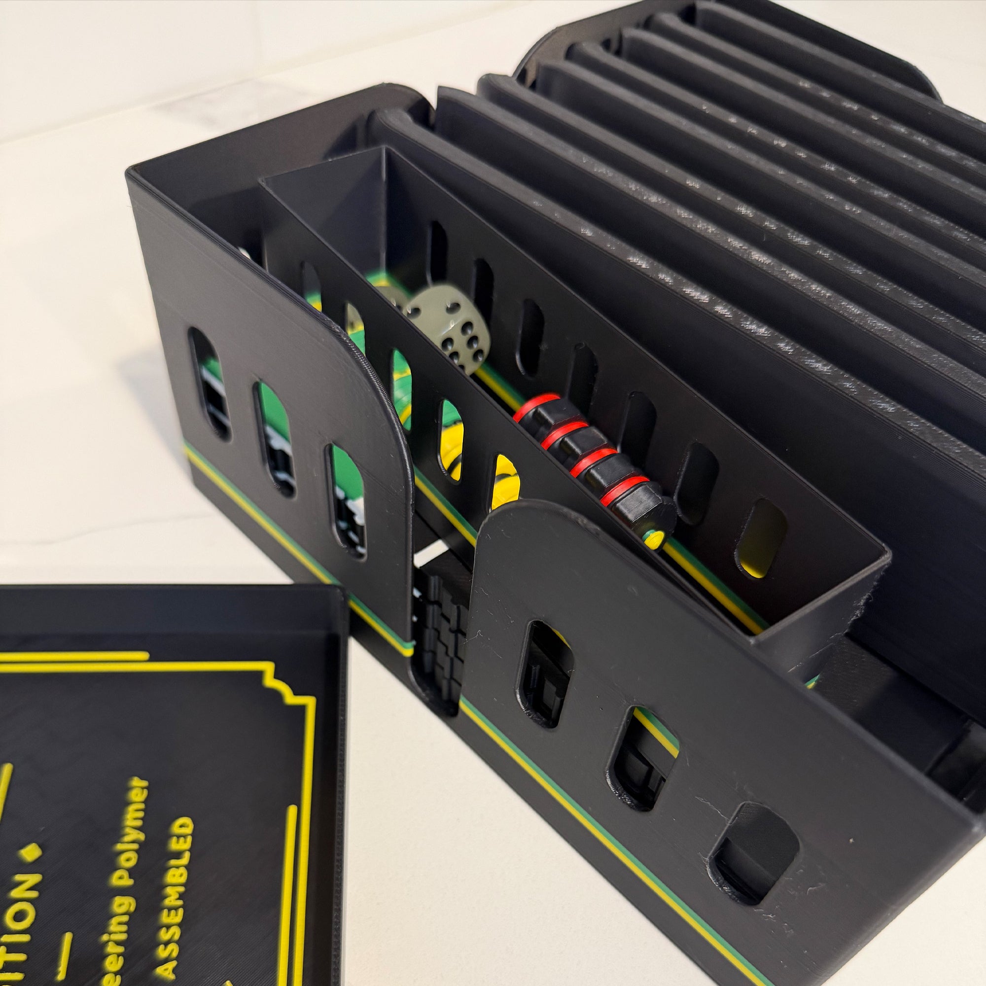 Storage case for the Lock Pon Stop 16×16 modular magnetic Ludi board, holding the board plates, magnetic game pieces, and dice.