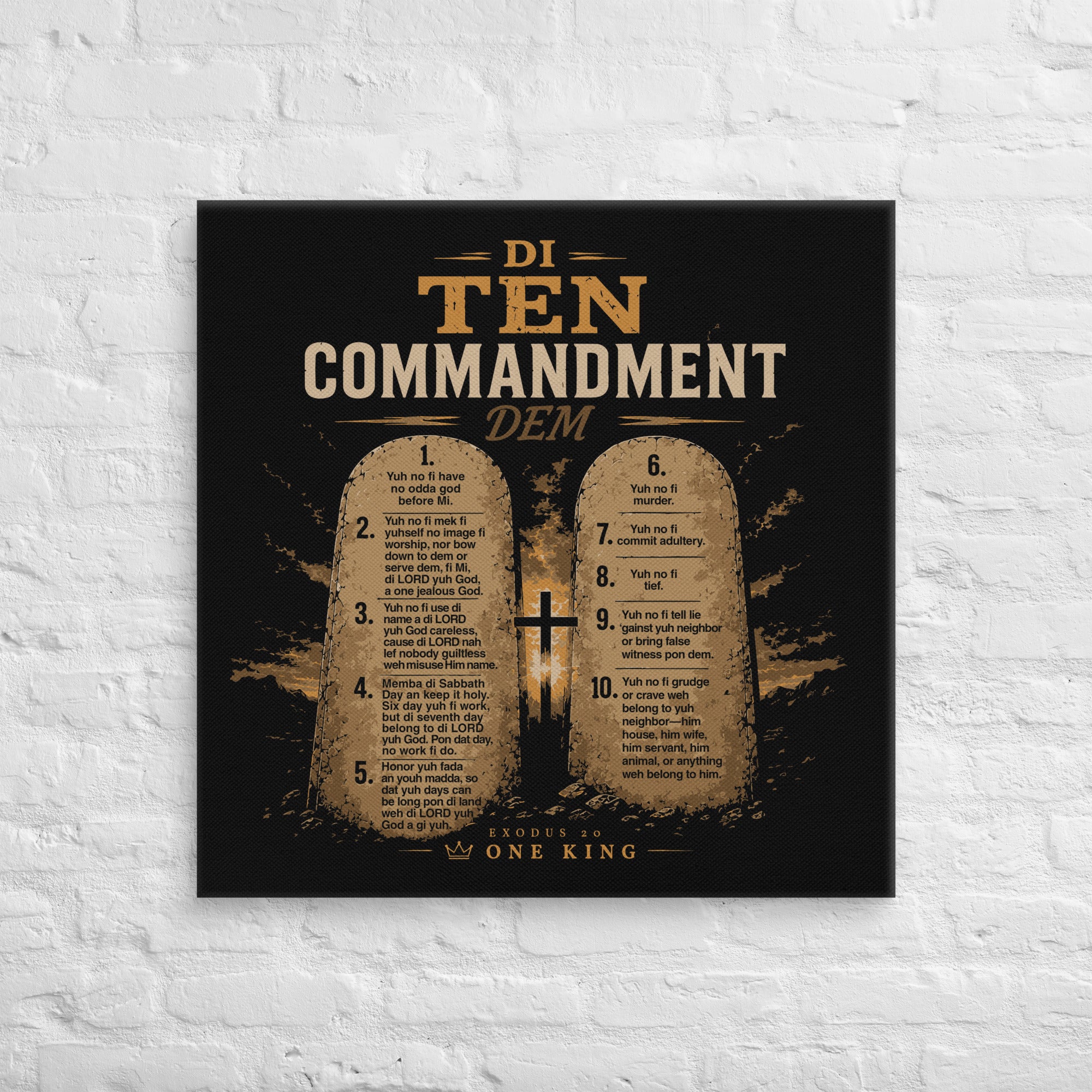 30 × 30 inch black and gold Di Ten Commandment Dem Jamaican Patois Christian canvas displayed on a white brick wall.

