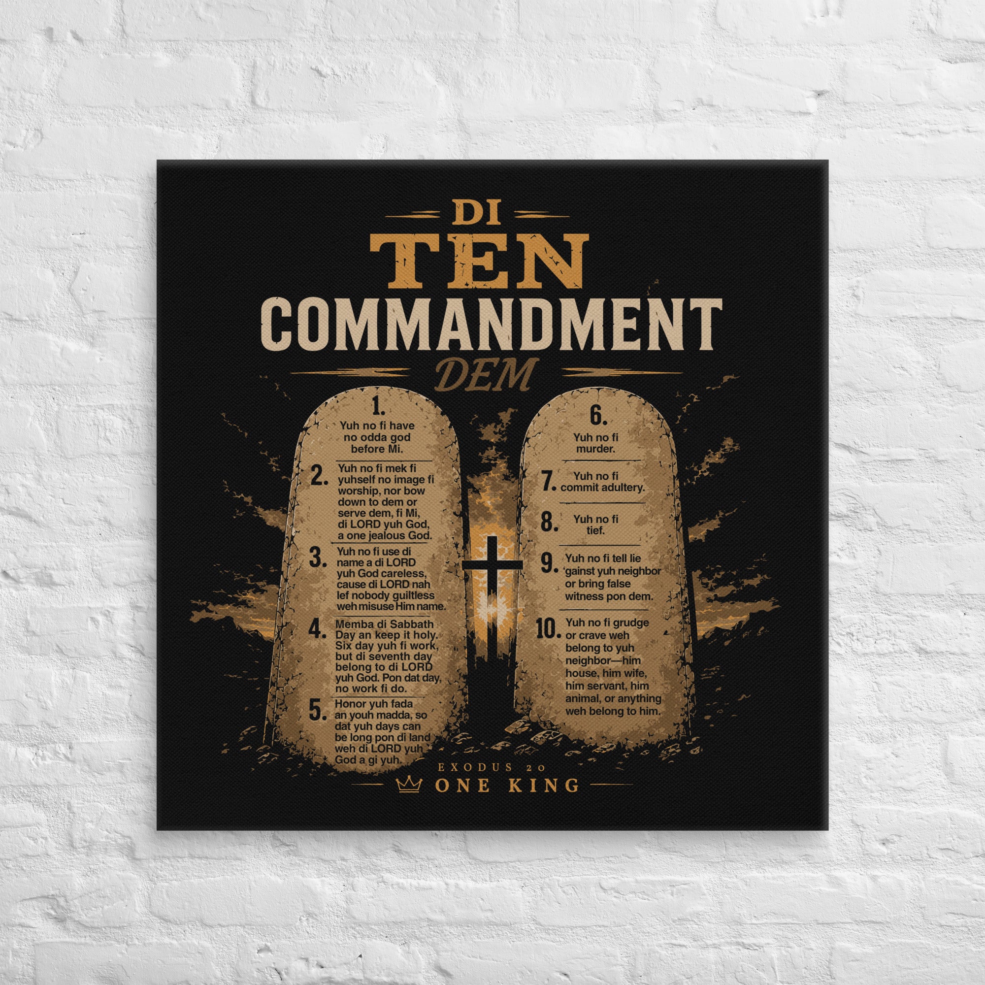 Product mockup32 × 32 inch black and gold Di Ten Commandment Dem Jamaican Patois Christian canvas displayed on a white brick wall.
