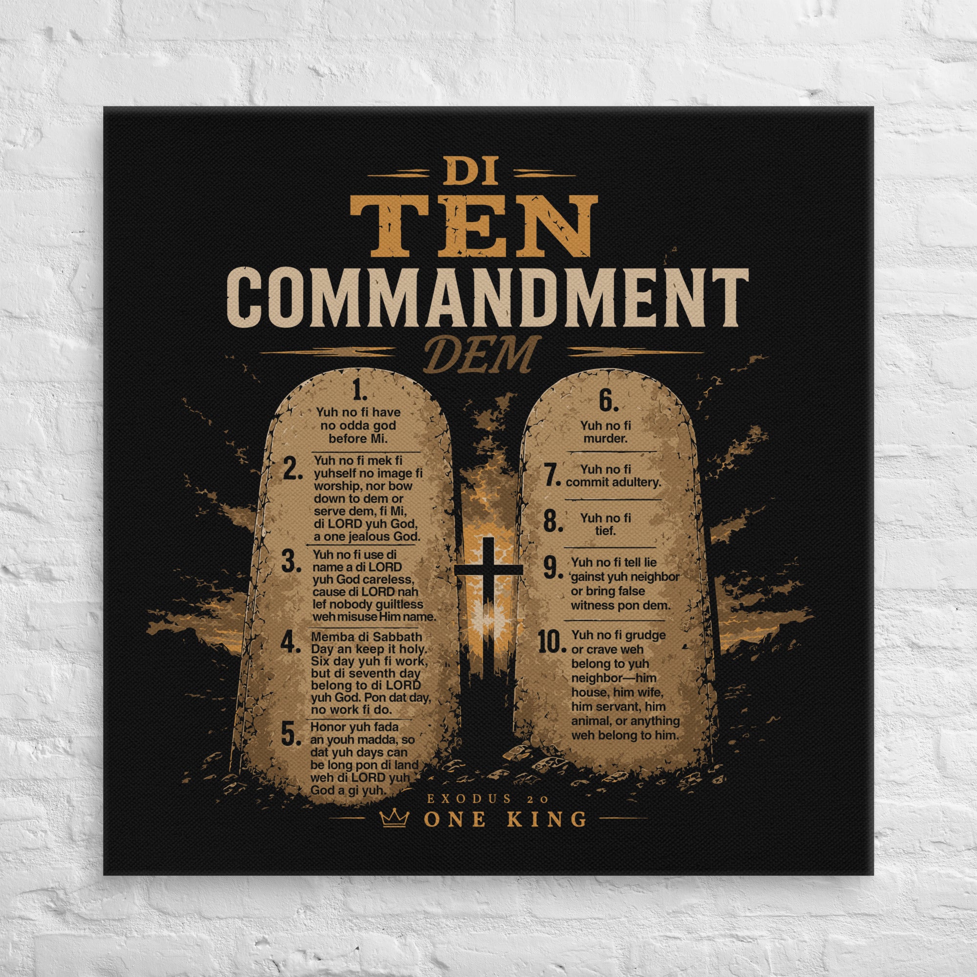 37 × 37 inch black and gold Di Ten Commandment Dem Jamaican Patois Christian canvas displayed on a white brick wall.
