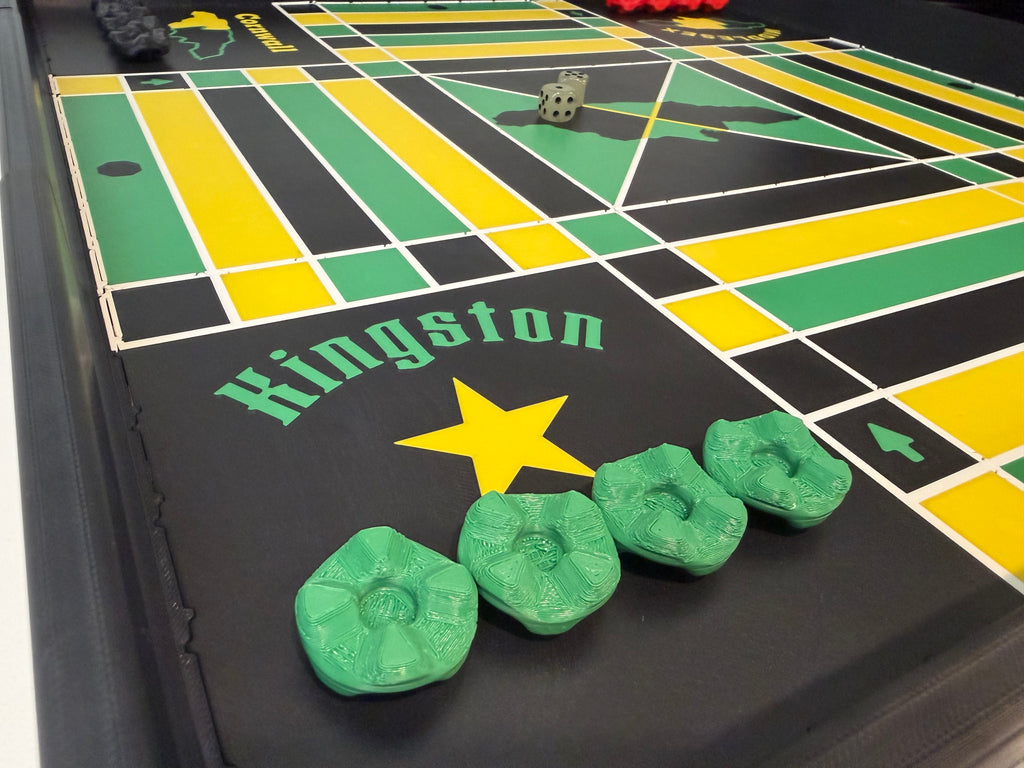 Close-up of the Kingston corner on a premium 24x24-inch modular magnetic Jamaican Ludi board with magnetic stackable game pieces, Jamaica-inspired design, and durable ASA construction.