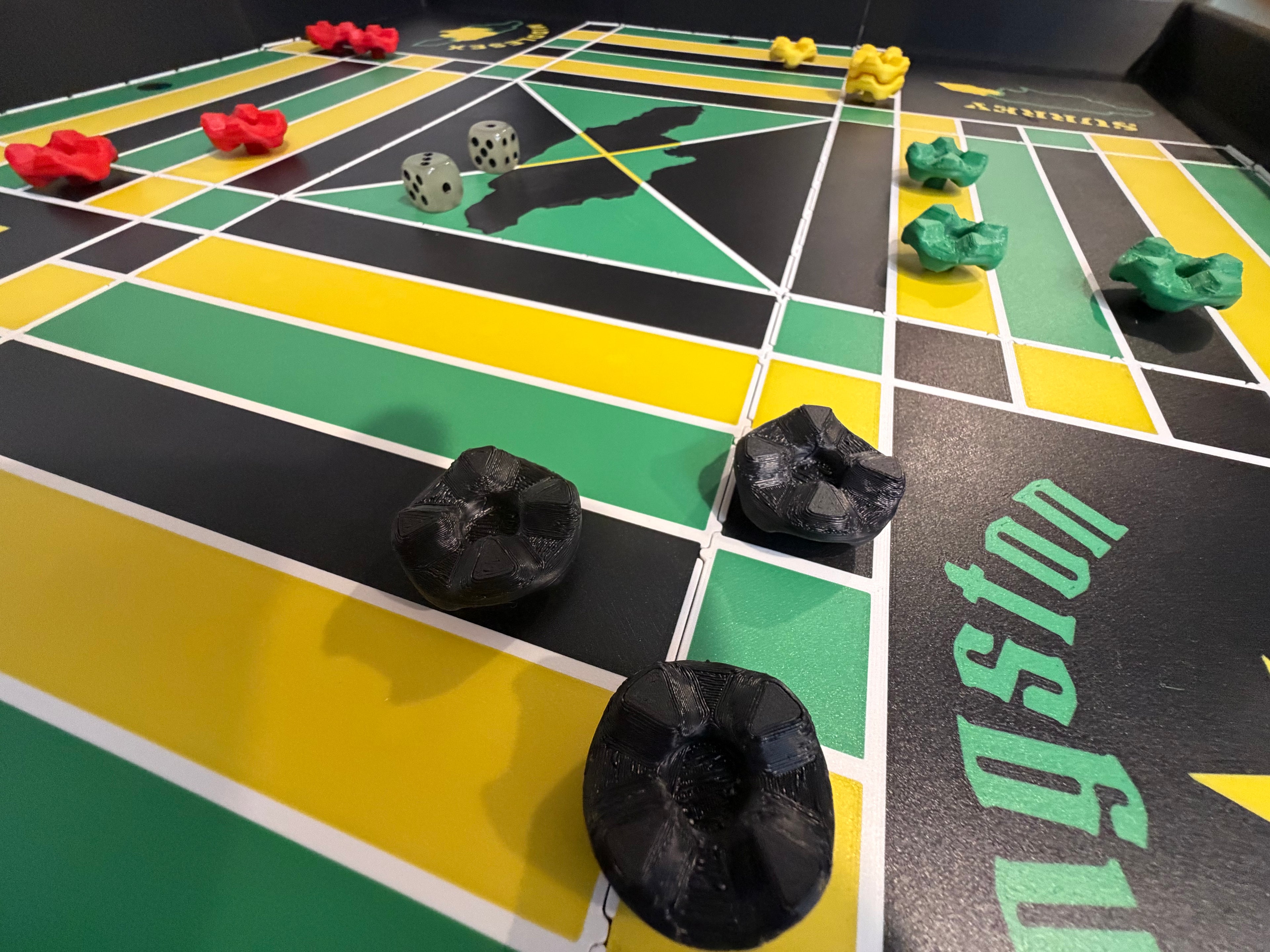Close-up of the Lock Pon Stop 24x24 Modular Magnetic Ludi Board during gameplay, featuring magnetic stackable game pieces, dual dice, and smooth modular snap-together panels inspired by Jamaica's national colors.