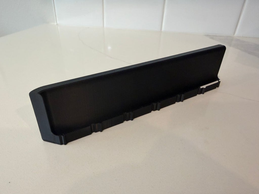 Interior view of a side wall panel for the Lock Pon Stop 24x24 Modular Magnetic Ludi Board, featuring a raised border to help contain game pieces, precision snap-together connectors, built-in magnetic alignment, and durable ASA construction.