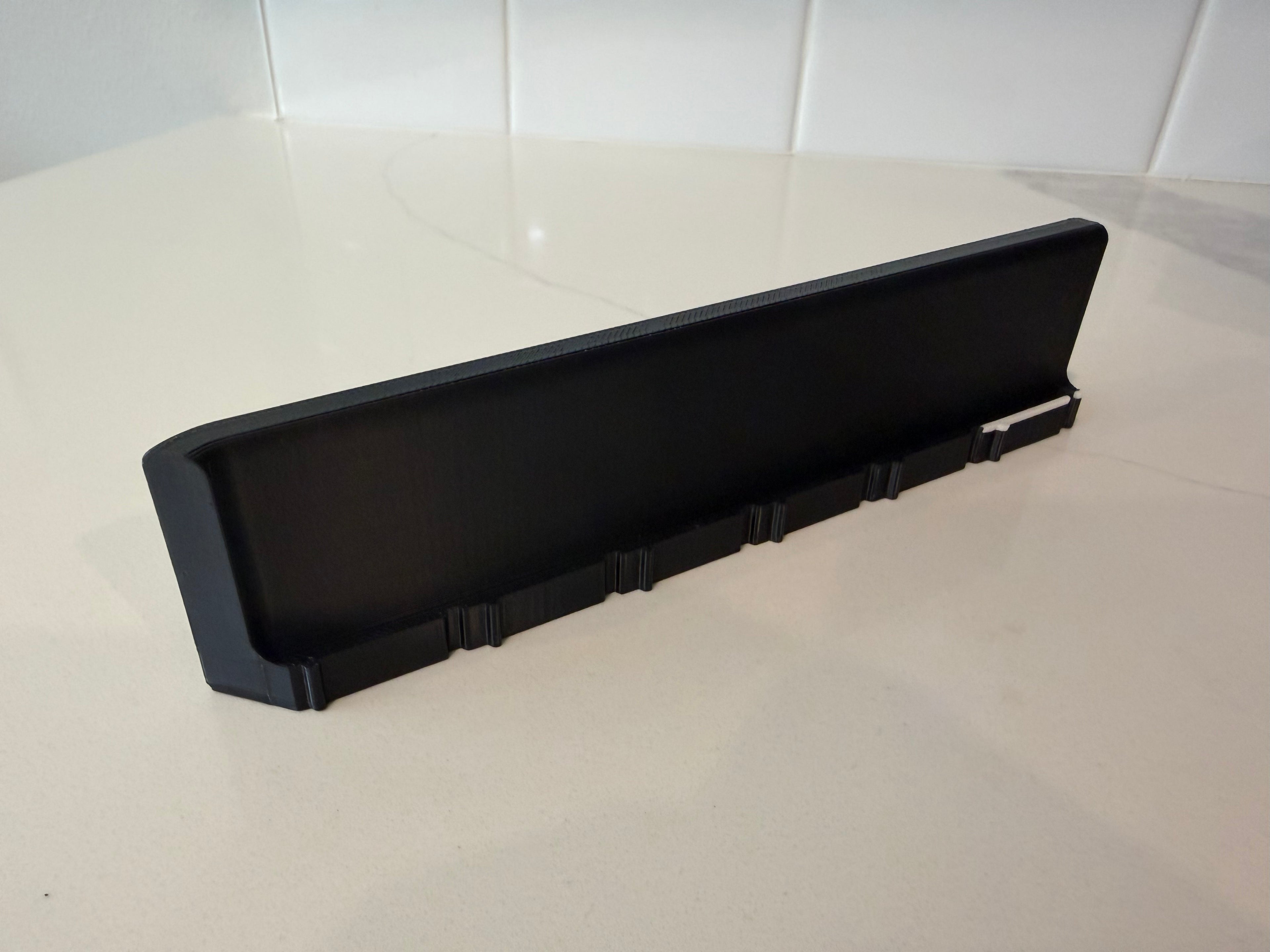 Interior view of a side wall panel for the Lock Pon Stop 24x24 Modular Magnetic Ludi Board, featuring a raised border to help contain game pieces, precision snap-together connectors, built-in magnetic alignment, and durable ASA construction.