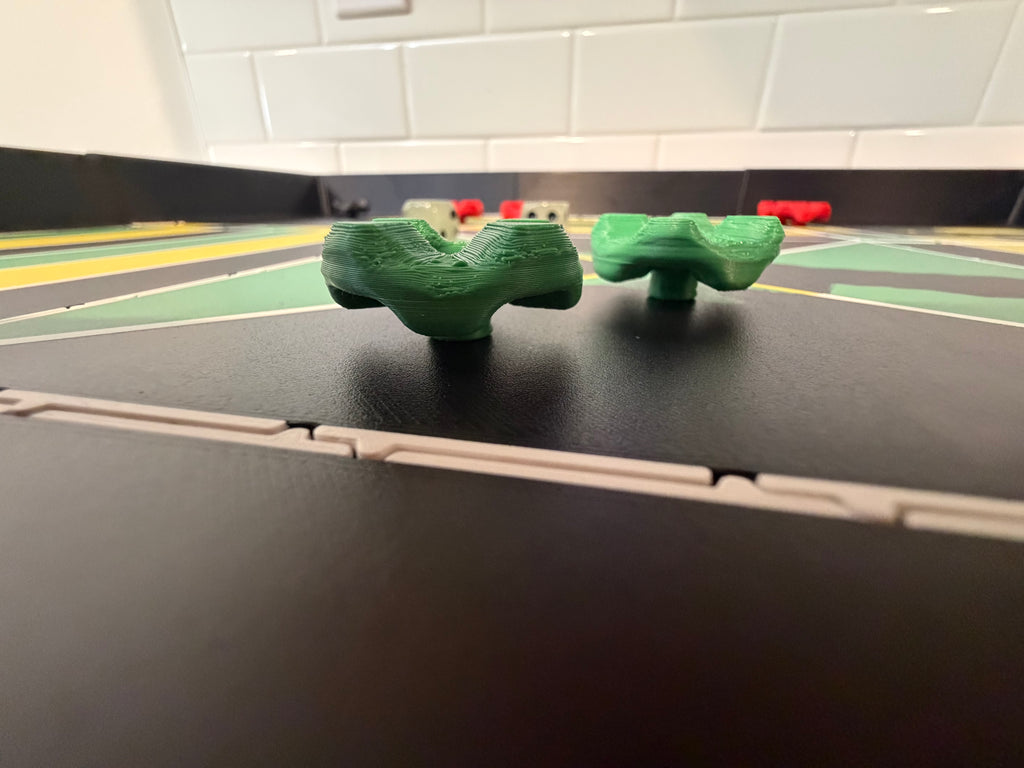 Low-angle view of magnetic game pieces on the Lock Pon Stop 24x24 Modular Magnetic Ludi Board, highlighting the low-profile design, stackable construction, precision-fit modular panels, and premium ASA craftsmanship.