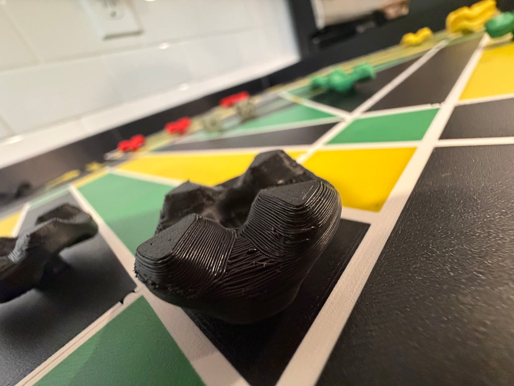 Macro close-up of a magnetic game piece on the Lock Pon Stop 24x24 Modular Magnetic Ludi Board, highlighting the premium textured finish, stackable design, and smooth gameplay on the modular magnetic board.