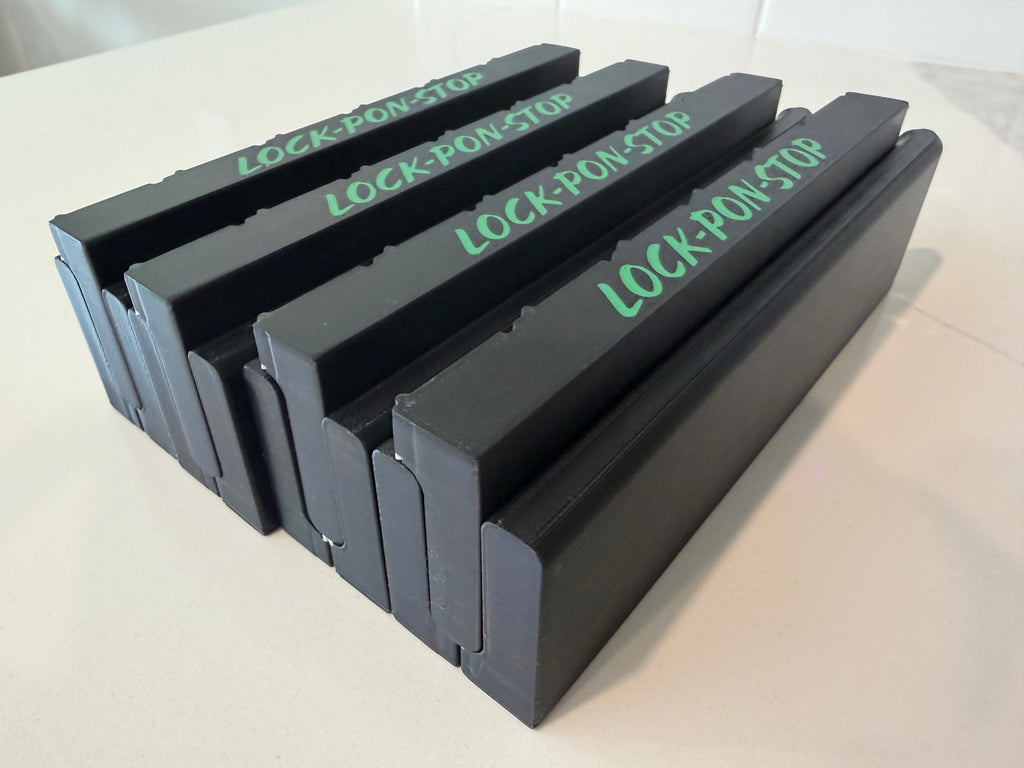 Stacked modular side walls for the Lock Pon Stop 24x24 Modular Magnetic Ludi Board, featuring branded panels, precision snap-together construction, built-in magnetic connections, and durable ASA material for secure assembly and portability.