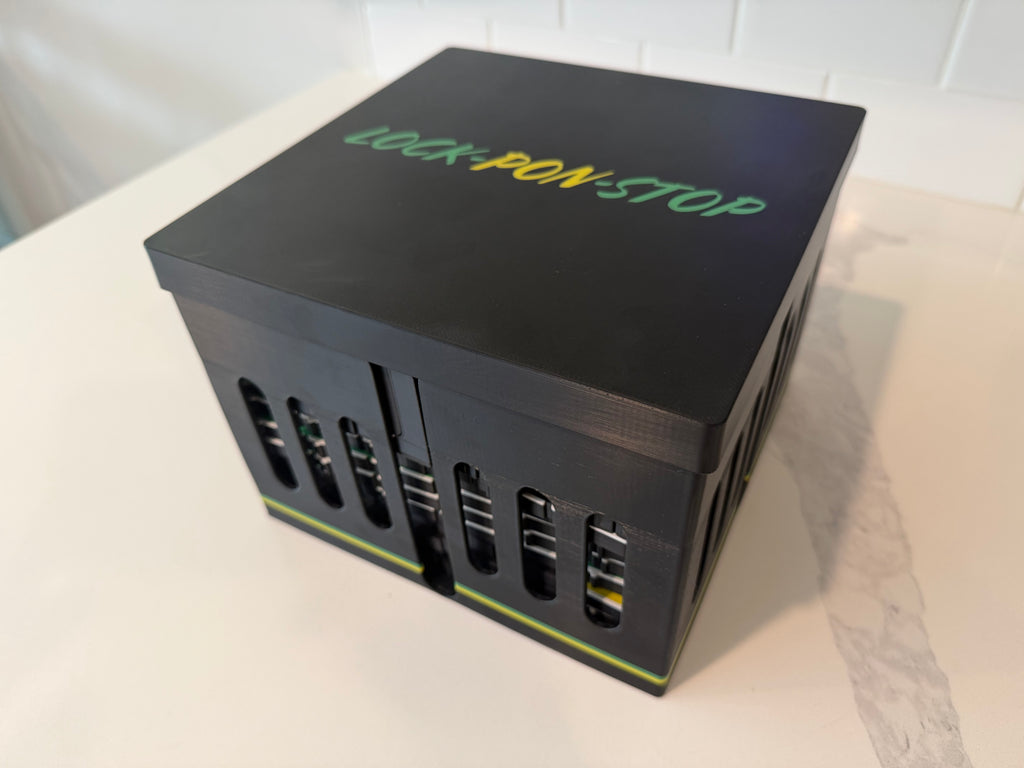 Closed Lock Pon Stop storage case for the 24x24 Modular Magnetic Ludi Board, securely holding all modular board sections, magnetic game pieces, and accessories in a durable, travel-ready ASA case.