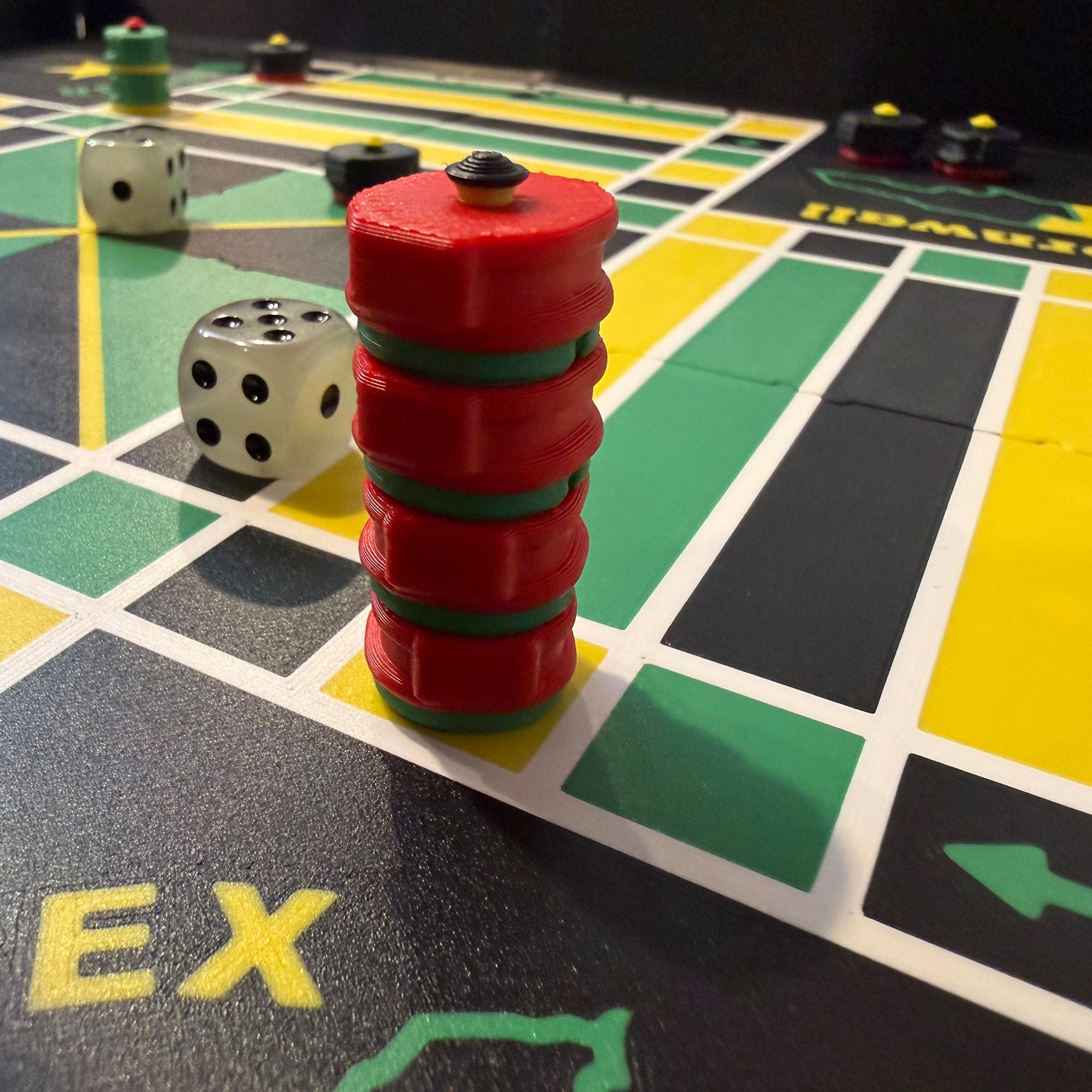 Close-up of stacked magnetic Ludi game pieces on the Lock Pon Stop 16×16 modular magnetic board, demonstrating the gate stacking feature.