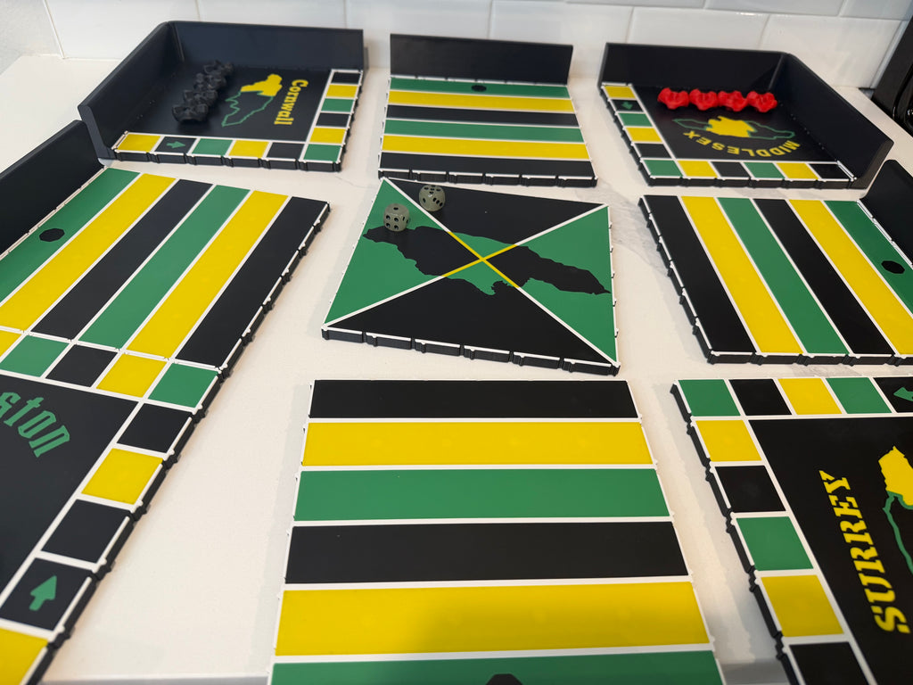 All modular sections of the 24x24-inch magnetic Jamaican Ludi board displayed before assembly, showcasing precision-fit snap-together panels, magnetic side trays, center tile, and durable ASA construction for easy transport and setup.