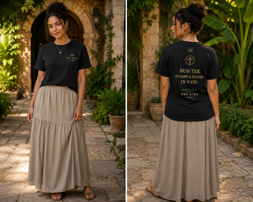 Woman wearing a black t-shirt with text and a beige skirt outdoors. Nuh tea di name a di Lord in vain. Cross on back. Exodus 20:7. Third Commandment Christian Jamaican Patois Shirt. Crown on front. One King YHWH. Roman Numeral 3.