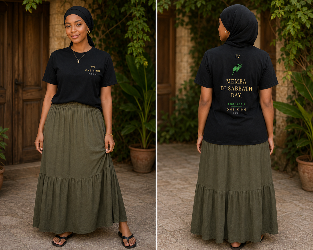 Woman wearing a black t-shirt with text and an olive green skirt outdoors. Fourth Commandment Memba Di Sabbath Day Jamaican Patois