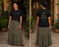 Woman wearing a black t-shirt with text and a green skirt outdoors. Fifth Commandment 5 Honor Yuh Fada An Yuh Madda Exodus 20:12