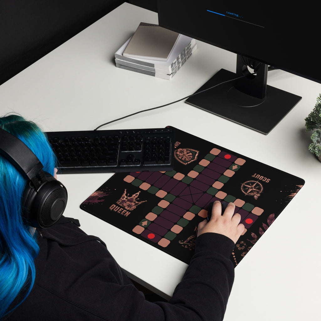 Woman with blue hair using the compact 18 × 16-inch Jungle Queen Jamaican Ludi mouse pad with a computer mouse.
Set the focal point on the center square of the Ludi playing path.