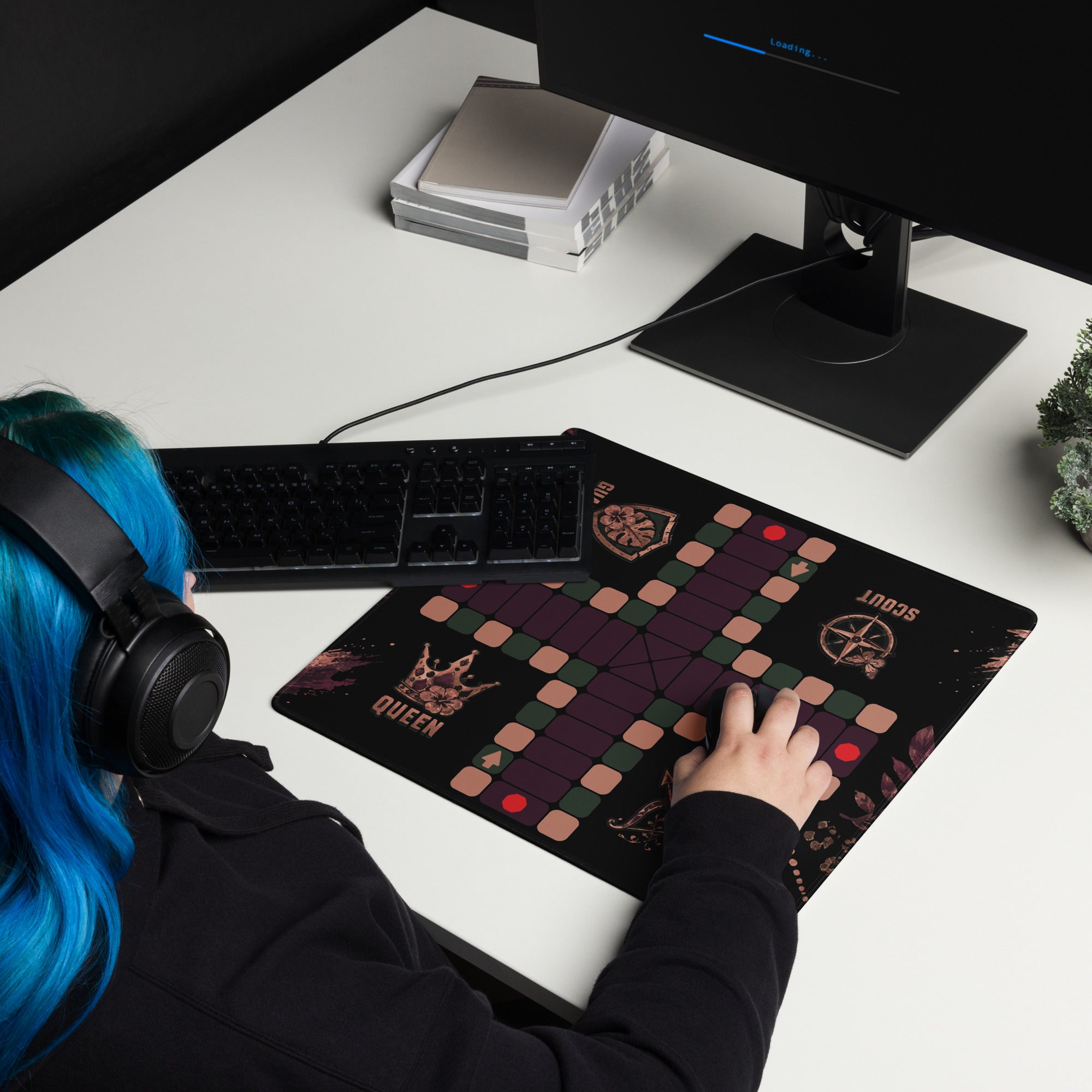 Woman with blue hair using the compact 18 × 16-inch Jungle Queen Jamaican Ludi mouse pad with a computer mouse.
Set the focal point on the center square of the Ludi playing path.