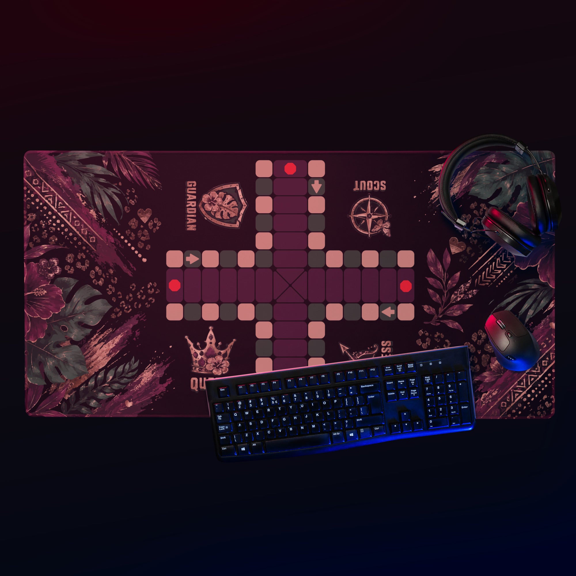Top-down view of the 36 × 18-inch Jungle Queen Jamaican Ludi mouse pad with a keyboard, mouse, and headphones under pink and blue lighting.