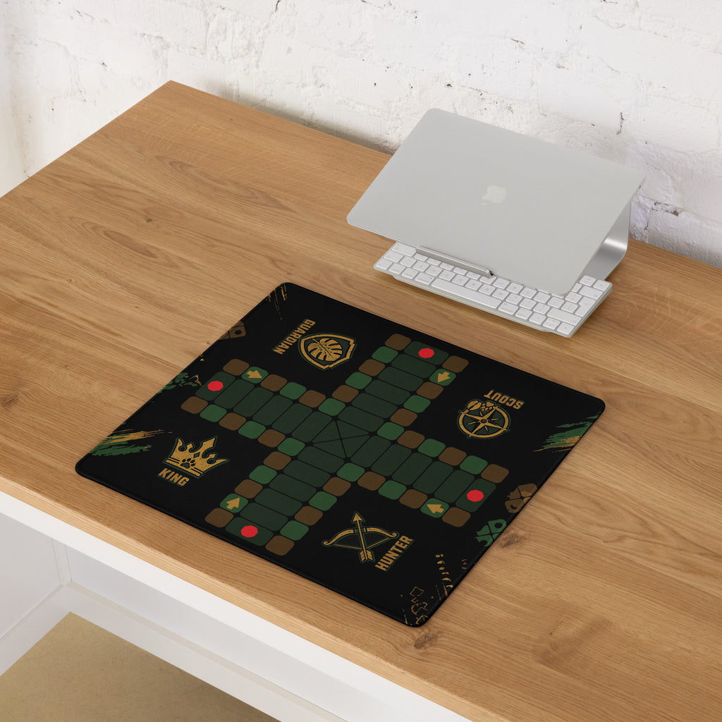 Compact 18 × 16-inch Jungle Roles Jamaican Ludi game board mouse pad displayed on a wooden computer desk.