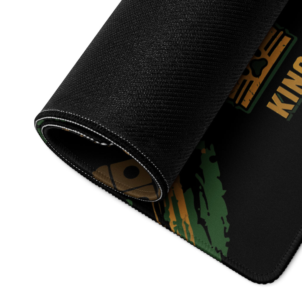 Close-up of the compact Jungle Roles Ludi mouse pad showing its textured non-slip rubber base and stitched edge.